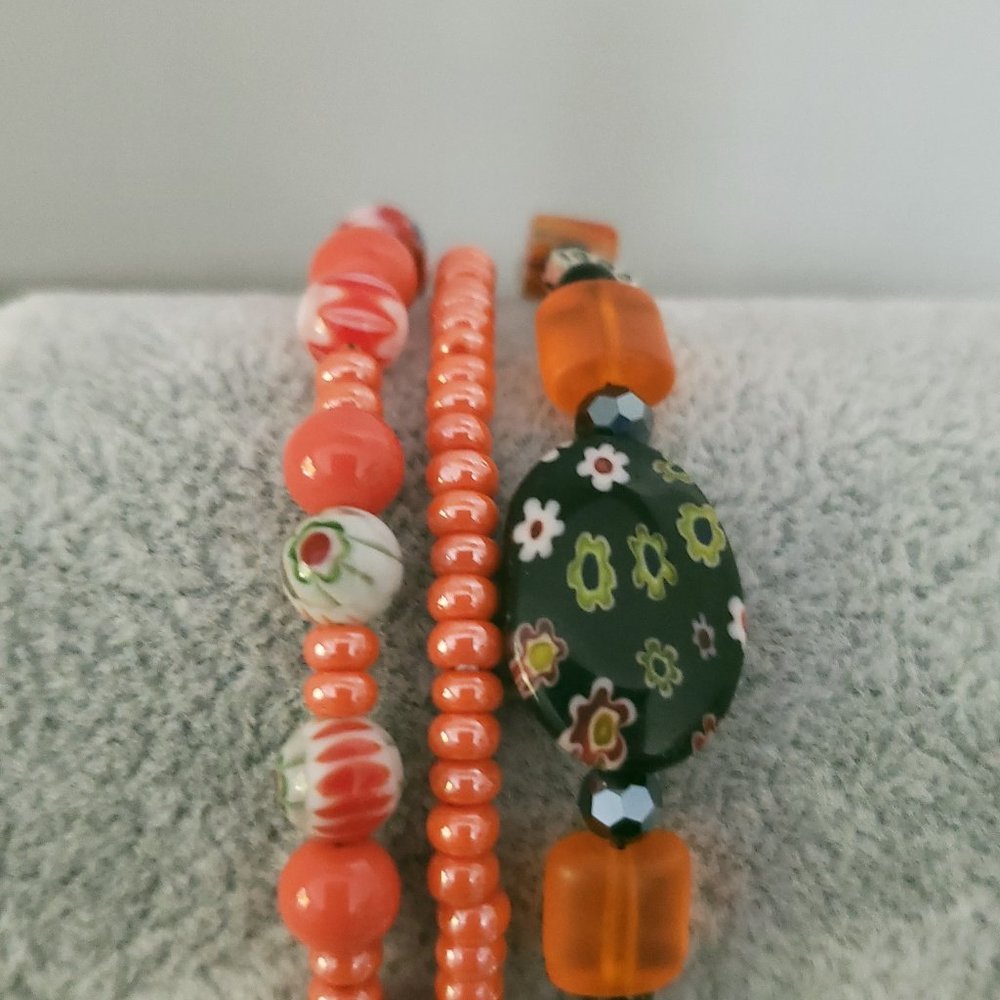 Orange elastic stretch bracelet and millefoiori beaded braclets
